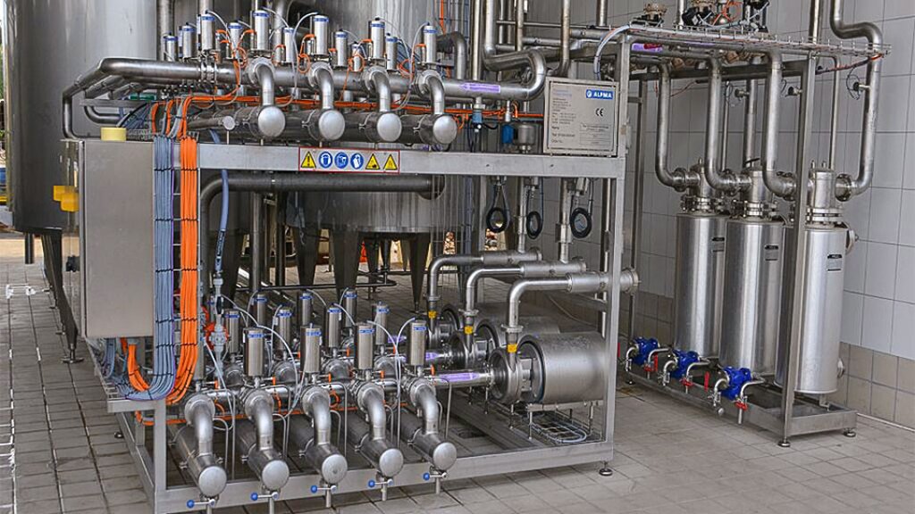 CIP system: Piping system with valves and pumps for automated cleaning within an ALPMA process plant.