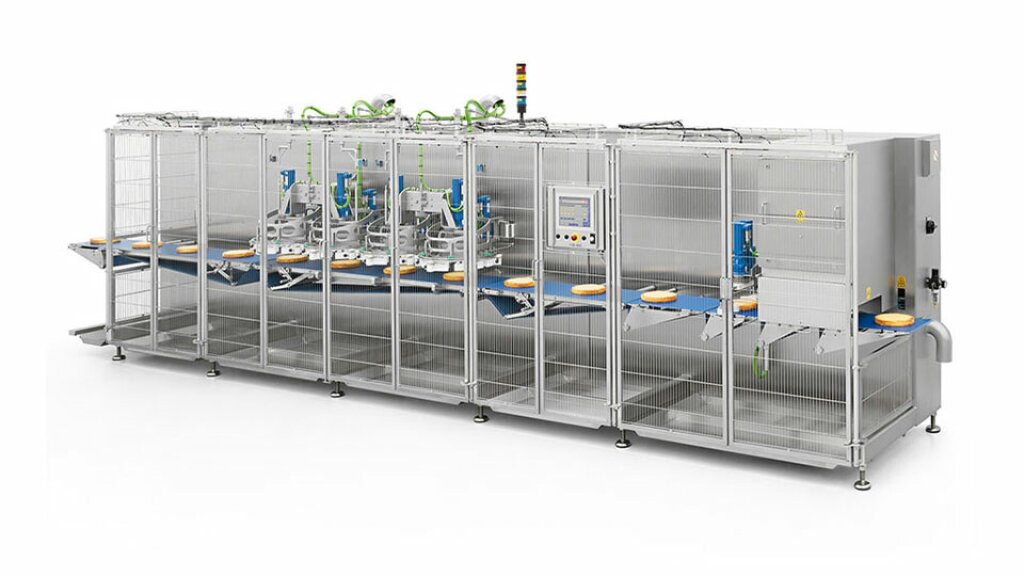 KS Cake Slicer – Industrial cutting machine for slicing round or rectangular cakes, featuring a stainless steel housing, conveyor belt, and automated control system.
