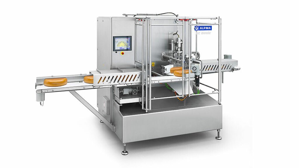 SC Basic industrial stainless steel segment cutter featuring a protective enclosure, conveyor belt, and control panel; designed for the gentle, single-cut slicing of pre-portioned cheese half-moons into segments of any desired size.