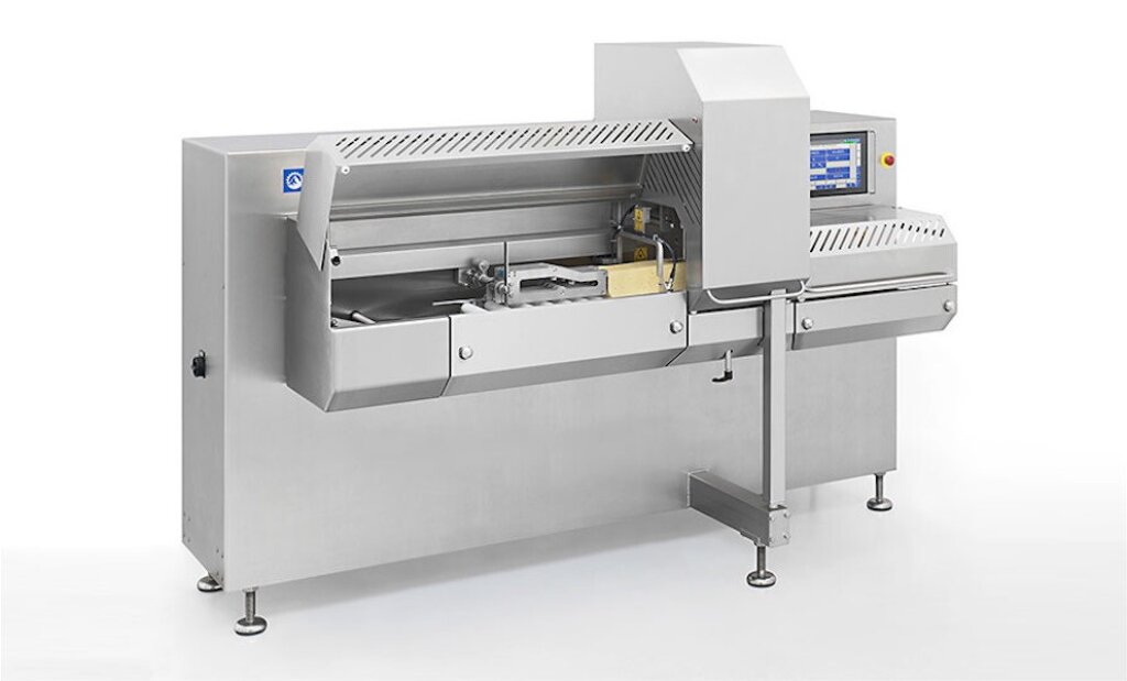 Industrial CUT Basic portion cutter made of stainless steel, featuring a protective enclosure, cutting mechanism, and control panel, designed for cutting cheese bars into portions.